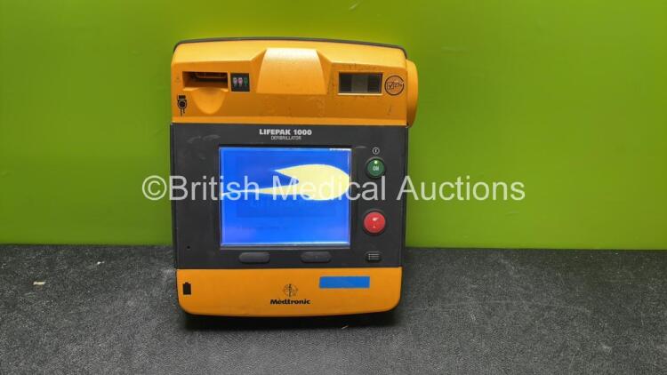 Medtronic Lifepak 1000 Defibrillator (Powers Up with Cracked Screen when Tested with Stock Battery-Battery Not Included) *SN 35225022*