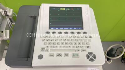 2 x Edan SE-1200 Express ECG Machines on Stands (Both Power Up with Casing Damage - See Photos) *311072-M15A02240001* - 2