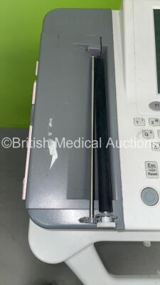 2 x Edan SE-1200 Express ECG Machines on Stands (Both Power Up with Casing Damage - See Photos) *311072-M15A02240001* - 8