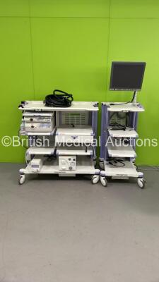 2 x Olympus Stack Trolleys with Olympus OEV191H Monitor, Olympus Evis Lucera CV-260SL Digital Processor, Olympus Evis Lucera CV-260SL Light Source, Olympus MAJ-1154 Pigtail Connector, Olympus ECS-260 Connector Cable, Olympus UCR Unit and Olympus KV-5 Suct