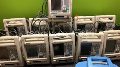 Job Lot Including 11 x Baxter Pumps, 1 x CareFusion Alaris SE Pump and 1 x CareFusion Alaris GH Guardrails Plus Syringe Pump *SN 21021779DB / 24040258DL / 21021757DB / 24040026DL / 24040339DL / 21021755DB / 135098140 / 800280235* (in cage) - 4