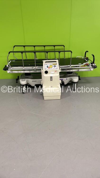 1 x Stryker Transport Patient Trolley (Hydraulics Tested Working) and 1 x Oxylitre Mobile Suction System (Powers Up)