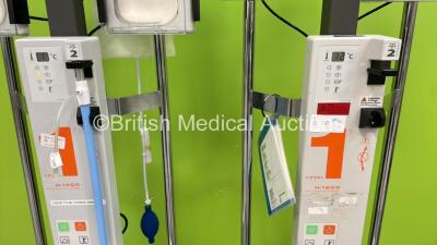 2 x Smiths Medical Level 1 H-1200 Fast Flow Fluid Warmers, 1 x Therapy Equipment Ltd Suction Pump and 1 x Welch Allyn LS-15C Patient Examination Lamp (No Power) - 4