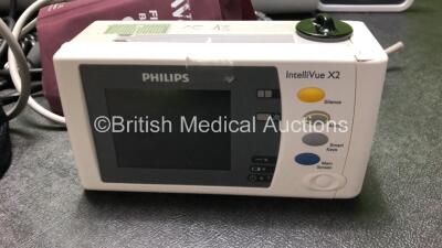 Job Lot Including 1 x Philips IntelliVue X2 Portable Patient Monitor Including ECG, SpO2, NBP, Temp and Press Options (Damage to Casing - See Photos, No Power, Suspected Flat Battery) 1 x Covidien Genius 3 Tympanic Thermometer (Missing Battery Casing) 1 x - 5