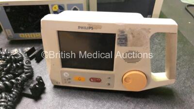 Mixed Lot Including 1 x Electrolux Fridge, 1 x Kontron Micromon 7142B Blood Pressure Patient Monitor (Powers Up with Fault) 2 x Welch Allyn Propaq CS Patient Monitors, 1 x Philips C1 Monitor, Quantity of Pump Clips, 1 x SAM 12 Suction Unit (Powers Up) and - 2