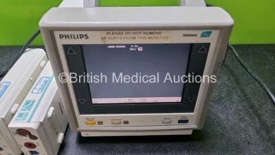 Job Lot Including 2 x Philips M3046A Patient Monitors (Both Power Up 1 x with Missing Module Clip - See Photo) and 2 x Philips M3001A ModuleS Including ECG, SpO2, NBP, Press and Temp Options *SN DE51299358 / DE22729898 / DE00850692 / DE00850695* - 2