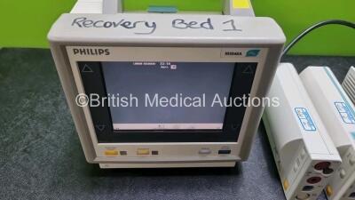 Job Lot Including 2 x Philips M3046A Patient Monitors (Both Power Up 1 x with Missing Module Clip - See Photo) and 2 x Philips M3001A ModuleS Including ECG, SpO2, NBP, Press and Temp Options *SN DE51299358 / DE22729898 / DE00850692 / DE00850695* - 3