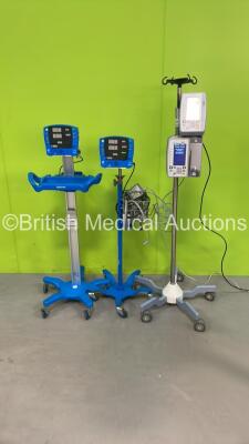 Job Lot Including 2 x GE Carescape V100 Dinamap Monitors on Stands (Both Power Up with Missing Display Covers) and 2 x Iradimed MRidium MRI Infusion Systems with 1 x Power Supply on Stand (All Power Up) *IR65100515 / IR60101008 / SDT08250324SP*