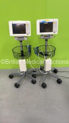 2 x Drager Infinity Delta Patient Monitors on Stands with 2 x Power Supplies and Docking Stations (Both Power Up with Marks to 1 x Screen - See Photo) *5399773252 / 5399576447*