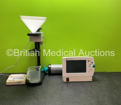 Mixed Lot Including 1 x Flexilog Flowmate 2 Uroflowmetry Unit (Powers Up) 1 x Koko Calibration Syringe and 1 x GE Datex Ohmeda F LBAT O2 Patient Monitor Including ECG, SpO2, NIBP and T Options with 2 x Batteries (Untested Due to Missing Power Supply) *SN 