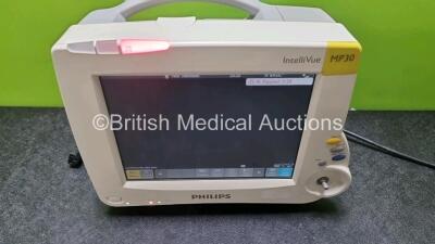 Job Lot Including 1 x Philips IntelliVue MP30 Patient Monitor (Powers Up Missing Dial - See Photo) and 2 x IntelliVue X2 Handheld Patient Monitors Including ECG, SpO2, NBP, Press and Temp Options (Both Power Up 1 x with Faulty Screen - See Photo) *SN DE83 - 2