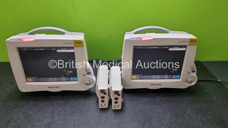 Job Lot Including 2 x Philips IntelliVue MP30 Patient Monitors (Both Power Up) and 2 x Philips M3001A Modules Opt A01C06 Including ECG, SpO2, NBP, Press and Temp Options *SN DE3450DCRY / DE3450DCT2 / DE72847463 / DE72847466*