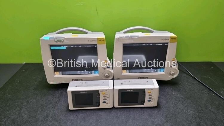 Job Lot Including 2 x Philips IntelliVue MP30 Patient Monitors (Both Power Up) and 2 x IntelliVue X2 Handheld Patient Monitors Including ECG, SpO2, NBP, Press and Temp Options (Both Power Up) *SN DE03758171 / DE03758134 / DE72882353 / DE72882360*