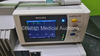 Job Lot Including 2 x Philips IntelliVue MP50 Patient Monitors (Both Power Up) and 2 x IntelliVue X2 Handheld Patient Monitors Including ECG, SpO2, NBP, Press and Temp Options (Both Power Up Both with Missing Battery Cover and 1 x with Damage To Casing - - 6