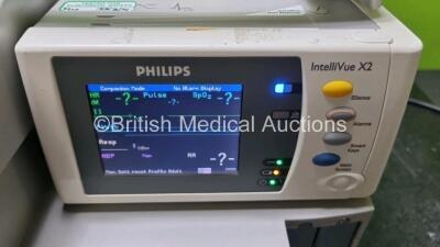 Job Lot Including 2 x Philips IntelliVue MP30 Patient Monitors (Both Power Up 1 x with Light Scratch In Screen - See Photo) and 2 x IntelliVue X2 Handheld Patient Monitors Including ECG, SpO2, NBP, Press and Temp Options (Both Power Up) *SN DE03758270 / D - 7