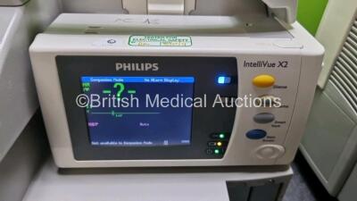 Job Lot Including 2 x Philips IntelliVue MP30 Patient Monitors (Both Power Up 1 x with Light Scratch In Screen - See Photo) and 2 x IntelliVue X2 Handheld Patient Monitors Including ECG, SpO2, NBP, Press and Temp Options (Both Power Up) *SN DE03758270 / D - 8