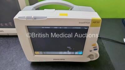 Job Lot Including 2 x IntelliVue MP30 Patient Monitors (Both Power Up 1 x with Light Scratching on Screen on Screen - See Photo) and 1 x IntelliVue MP70 Patient Monitor (Powers Up with Light Scratching On Screen - See Photo) *SN DE72882396 / DE72882369 / - 2