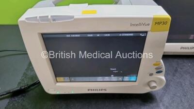 Job Lot Including 2 x IntelliVue MP30 Patient Monitors (Both Power Up 1 x with Light Scratching on Screen on Screen - See Photo) and 1 x IntelliVue MP70 Patient Monitor (Powers Up with Light Scratching On Screen - See Photo) *SN DE72882396 / DE72882369 / - 3