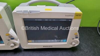 Job Lot Including 2 x IntelliVue MP30 Patient Monitors (Both Power Up Both with Light Scratching on Screen - See Photos) and 2 x IntelliVue X2 Handheld Patient Monitors Including ECG, SpO2, NBP, Press and Temp Options (Both Power Up 1 x with Damage to Cas - 2