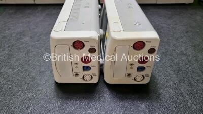 2 x Philips IntelliVue MP70 Patient Monitors (Both Power Up Both with Light Scratching on Screen - See Photo) with 2 x IntelliVue X2 Handheld Patient Monitors Including ECG, SpO2, NBP, Press and Temp Options (Both Power Up 1 x with Slight Damage to Casing - 2