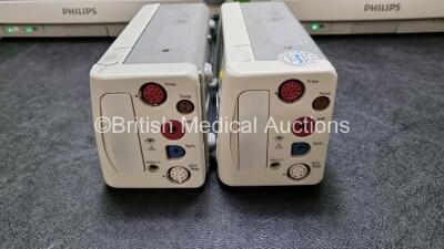 2 x Philips IntelliVue MP70 Patient Monitors (Both Power Up Both with Light Scratching on Screen and Missing Dials - See Photos) with 2 x IntelliVue X2 Handheld Patient Monitors Including ECG, SpO2, NBP, Press and Temp Options (Both Power Up Both with Sli - 2