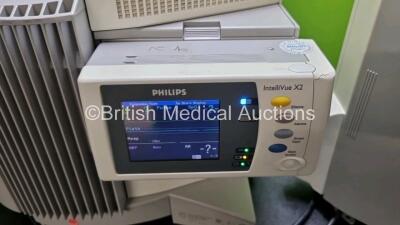 2 x Philips IntelliVue MP70 Patient Monitors (Both Power Up Both with Light Scratching on Screen and Missing Dials - See Photos) with 2 x IntelliVue X2 Handheld Patient Monitors Including ECG, SpO2, NBP, Press and Temp Options (Both Power Up Both with Sli - 8