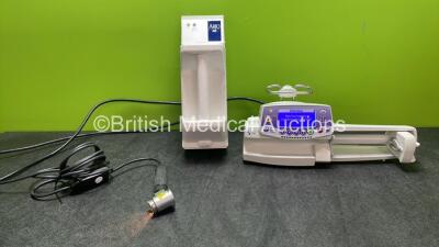 Mixed Lot Including 1 x Arjohuntleigh Type NDA2000-GB Battery Charger, 1 x Heine E7 Light and 1 x Fresenius Kabi TIVA Agilia Pump (All Power Up) *SN 23136, 01823020228249, SE27000019*