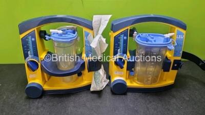 2 x LSU Laerdal Suction Unit with 2 x Suction Cups 2 x Batteries and Hoses (Both Power Up 1 x with Damage to Casing - See Photo)