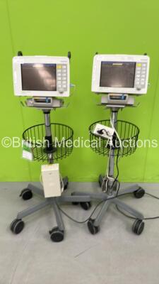 2 x Drager Infinity Delta Patient Monitors on Stands Including HemoMed1, Aux/Hemo2, Aux/Hemo3 and MultiMed Options with 2 x AC Power Supplies and 2 x Drager Infinity Docking Stations (Both Power Up)