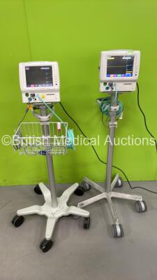 2 x Fukuda Denshi DS-7100 Dynascope Monitors on Stands ECG, SpO2, NIBP, BP, TEMP and Printer Options, 2 x NIBP Hoses and 2 x SpO2 Finger Sensors (Both Power Up) *SN 50000580, 36050103*