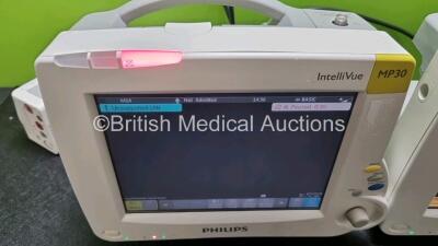 Job Lot Including 2 x Philips IntelliVue MP30 Patient Monitors (Both Power Up Both with Damage To Casing - See Photo) and 2 x Philips IntelliVue X2 Handheld Patient Monitors Including ECG, SpO2, NBP, Press and Temp Options (Both Power Up) *SN DE72850368 / - 3