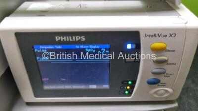 Job Lot Including 2 x Philips IntelliVue MP30 Patient Monitors (Both Power Up Both with Damage To Casing - See Photo) and 2 x Philips IntelliVue X2 Handheld Patient Monitors Including ECG, SpO2, NBP, Press and Temp Options (Both Power Up) *SN DE72850368 / - 6