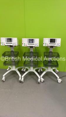 3 x Huntleigh Sonicaid FM800 Encore Fetal Monitors on Stands (All Power Up) *S/N 751DX0501470-13 / 751DX05014254-13 / 751DX0501451-13*