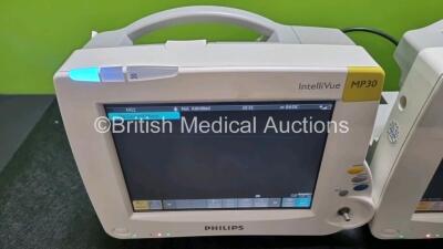 Job Lot Including 2 x Philips IntelliVue MP30 Patient Monitors (Both Power Up 1 x Missing Dial) and 2 x Philips IntelliVue X2 Handheld Patient Monitors Including ECG, SpO2, NBP, Press and Temp Options (Both Power Up) *SN DE03766612 / DE37607623 / DE728873 - 3