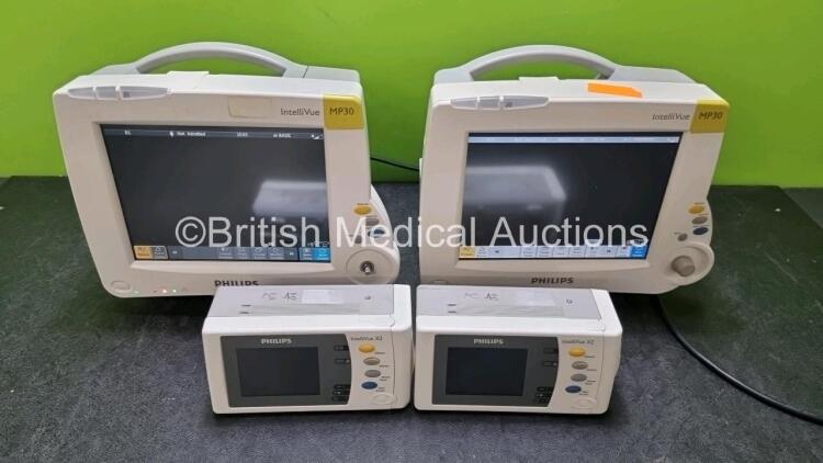 Job Lot Including 2 x Philips IntelliVue MP30 Patient Monitors (Both Power Up Both with Damage To Casing - See Photo) and 2 x Philips IntelliVue X2 Handheld Patient Monitors Including ECG, SpO2, NBP, Press and Temp Options (Both Power Up) *SN DE72870719 /