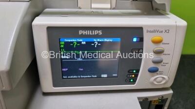 Job Lot Including 2 x Philips IntelliVue MP30 Patient Monitors (Both Power Up Both with Damage To Casing - See Photo) and 2 x Philips IntelliVue X2 Handheld Patient Monitors Including ECG, SpO2, NBP, Press and Temp Options (Both Power Up) *SN DE72870719 / - 9