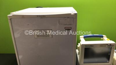 Mixed Lot Including 1 x Electrolux Fridge, 1 x Kontron Micromon 7142B Blood Pressure Patient Monitor (Powers Up with Fault) 2 x Welch Allyn Propaq CS Patient Monitors, 1 x Philips C1 Monitor, Quantity of Pump Clips, 1 x SAM 12 Suction Unit (Powers Up) and - 5