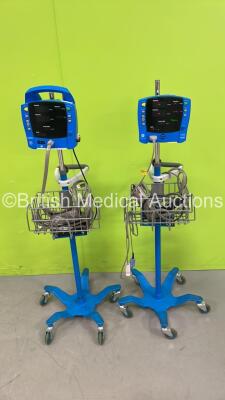 1 x GE Dinamap ProCare Auscultatory Vital Signs Monitor on Stand and 1 x GE Carescape V100 Vital Signs Monitor on Stand (Both Power Up - 1 x Loose Front Case - See Pictures)