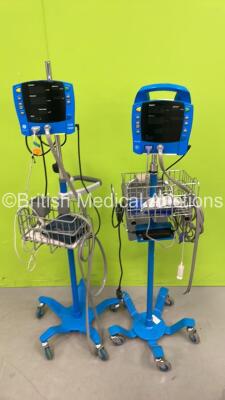 1 x GE Carescape V100 Vital Signs Monitor on Stand and 1 x GE ProCare Vital Signs Monitor on Stand (Both Power Up) *S/N SDT10130141SP / 2019194-001*