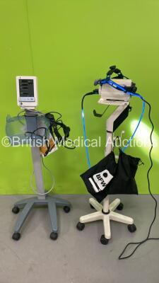 1 x Welch Allyn Solarc Light Source on Stand with 1 x Welch Allyn Headlight and 1 x BFW Headlight and 1 x Datascope Duo Patient Monitor on Stand (All Power Up)