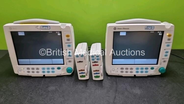 2 x GE Datex Ohmeda FM Patient Monitors (Both Power Up) with 1 x GE E-PSMP-00 Module Including ECG, SpO2, NIBP, T1, T2, P1 and P2 Options and 1 x *SN GE E-PSM-00 Module Including ECG, SpO2, NIBP, T1 and T2 Options *SN 6378504 / 65337522 / 6383796 / 649466