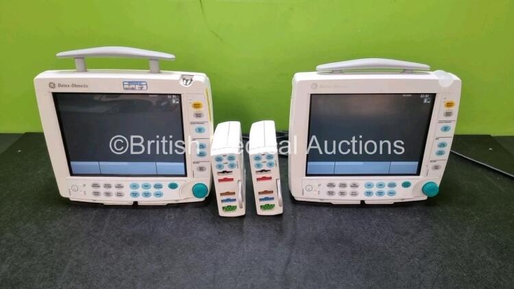 2 x GE Datex Ohmeda FM Patient Monitors (Both Power Up 1 x Missing Light Cover - See Photo) with 2 x GE E-PSMP-00 Modules Including ECG, SpO2, NIBP, T1, T2, P1 and P2 Options *SN 6373064 / 6373105 / 6383803 / 6383804*