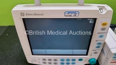 2 x GE Datex Ohmeda FM Patient Monitors (Both Power Up 1 x Missing Light Cover - See Photo) with 2 x GE E-PSMP-00 Modules Including ECG, SpO2, NIBP, T1, T2, P1 and P2 Options *SN 6373064 / 6373105 / 6383803 / 6383804* - 4