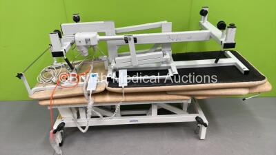 1 x Akron Electric Patient Examination Couch with Controller and 1 x Plinth 2000 Electric 3 Way Patient Examination Couch with Controller (Both Power Up)