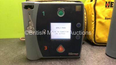 Job Lot Including 1 x Laerdal Heartstart FR2 Defibrillator and 1 x Philips Heartstart FR2+ Defibrillator in 2 x Carry Cases (Both Power Up with Stock Battery, Battery Not Included, 1 x Case Zip Broken) *SN 1002073351 / 1007257583* - 2