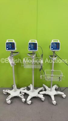 3 x CSI Criticare Comfort Cuff 506N3 Series Vital Signs Monitors on Stands (All Power Up)