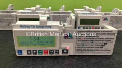 9 x CME Medical T34 Ambulatory Syringe Pumps (All Power Up with Stock Battery, Batteries Not Included, 3 x Missing Battery Covers, 1 x Damaged Casing - See Photos) *SN 18686 / S49292 / S55270 / 18742 / 18914 / 18704 / 18970 / S09764 / 18892* - 2