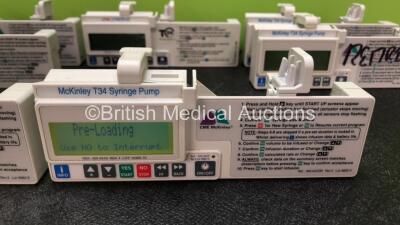 9 x CME Medical T34 Ambulatory Syringe Pumps (All Power Up with Stock Battery, Batteries Not Included, 3 x Missing Battery Covers, 1 x Damaged Casing - See Photos) *SN 18686 / S49292 / S55270 / 18742 / 18914 / 18704 / 18970 / S09764 / 18892* - 4