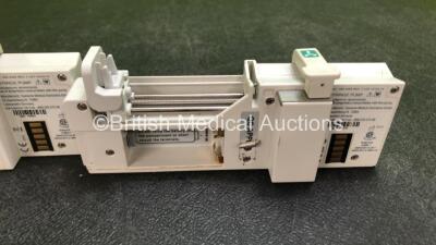 9 x CME Medical T34 Ambulatory Syringe Pumps (All Power Up with Stock Battery, Batteries Not Included, 3 x Missing Battery Covers, 1 x Damaged Casing - See Photos) *SN 18686 / S49292 / S55270 / 18742 / 18914 / 18704 / 18970 / S09764 / 18892* - 7