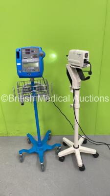 GE Dinamap Pro 400V2 Patient Monitor on Stand (Powers Up) and 1 x Welch Allyn Solarc Light Source on Stand (Powers Up with Good Bulb) *S/N 20102200603 / 20102200472*